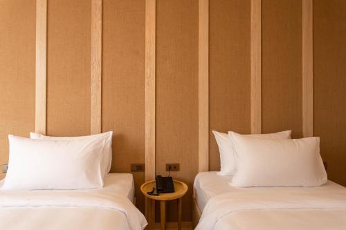 Una cama o camas en una habitación de Nine Hotel Chiangmai