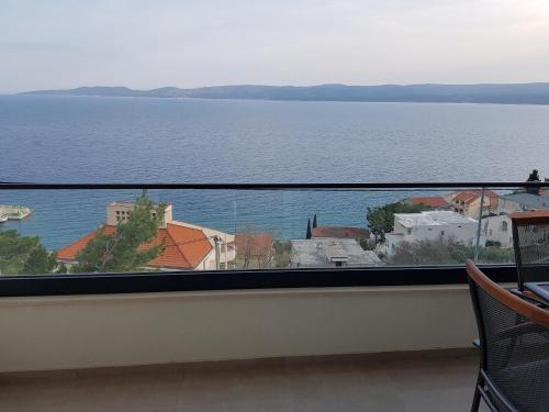 a view of the water from a balcony at La Vista apartments in Mimice