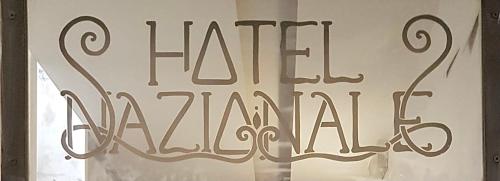 a sign in a window that reads fire hazard at Hotel Nazionale in Florence