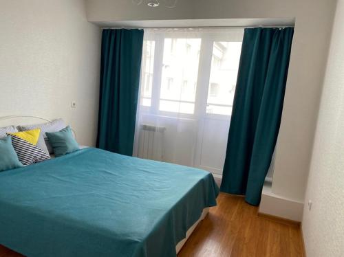 Una cama o camas en una habitación de Apartments 29 micro-district