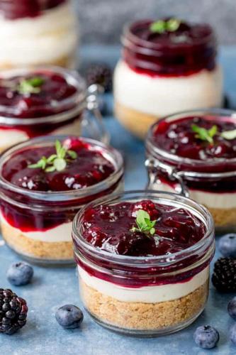 a group of desserts in glass jars on a table at The Capital Boutique B&B in Peniche