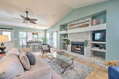 a living room with a couch and a fireplace at Coastal Hideaway about half Mi to Beach and Boardwalk! in Carolina Beach