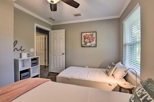 a bedroom with two beds and a window at Serene Live Oak Home with Fire Pit by River and SOSMP! in Live Oak
