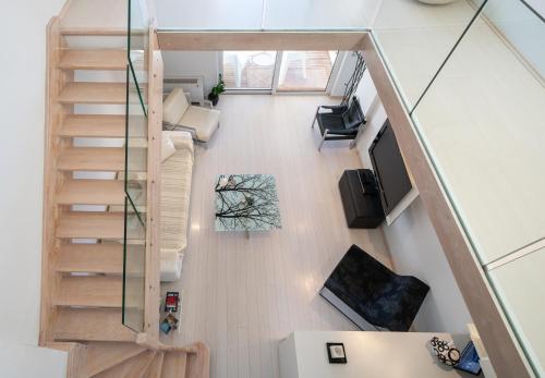 an overhead view of a living room with stairs at Seaside Maisonette in Itea in Itea