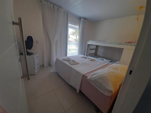 Un pat sau paturi într-o cameră la Casa em Jacumã com piscina e vista MAR