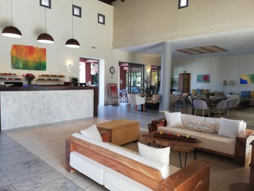a living room with a couch and a table at ASTRA Village Resort in Svoronata