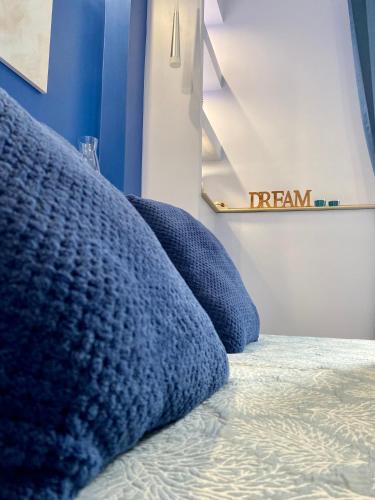 a row of pillows on a bed in a room at Ambramarina B&B in Nettuno