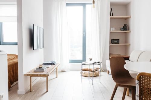 Televízia a/alebo spoločenská miestnosť v ubytovaní Powder Apartment - LoftAffair