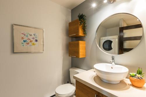 a bathroom with a sink and a mirror at Les Lofts St Jean in Quebec City