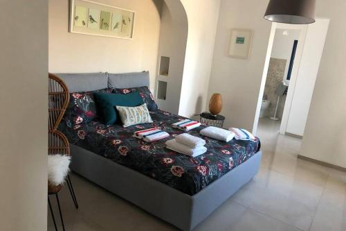 Giường trong phòng chung tại Cala Fornace