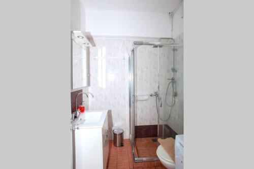 a bathroom with a shower and a toilet at City & beach apartment I in Rethymno in Rethymno