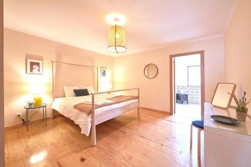 a bedroom with a bed in a room at Idyllic Lisbon Apartments With Amazing Courtyard, By TimeCooler in Lisbon