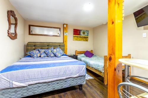 Postel nebo postele na pokoji v ubytování Hostal Mi Maravilla