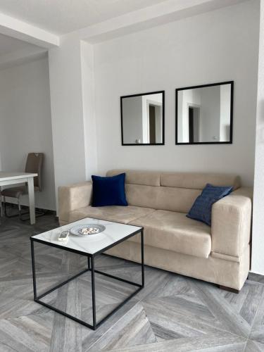 a living room with a couch and a table at Villa Casanego in Sutomore
