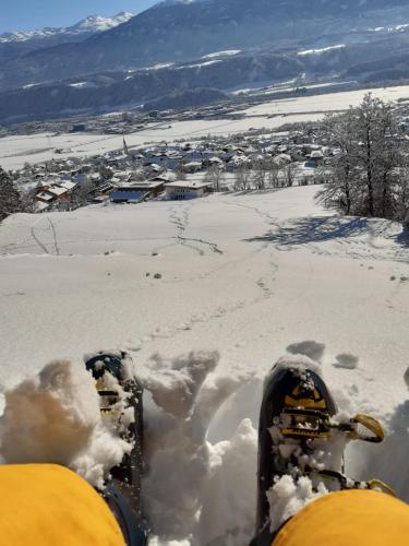 a person with their feet in the snow at Apartments Karlhof in Innsbruck