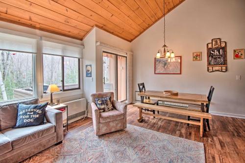 a living room with a couch and a table at Lincoln Condo with Amenities and Shuttle to Loon! in Lincoln