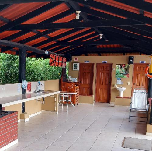 an outdoor patio with a kitchen and a sink at Casa Campestre Sol Y Luna in Quimbaya