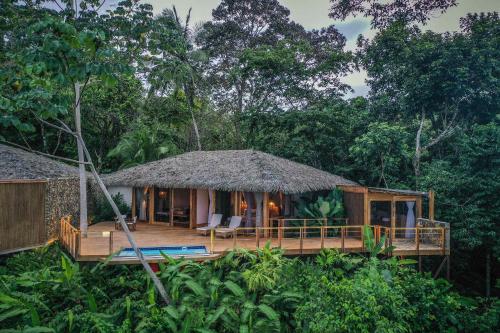 a house in the middle of the forest at Lapa Rios Lodge by Böëna in Puerto Jiménez