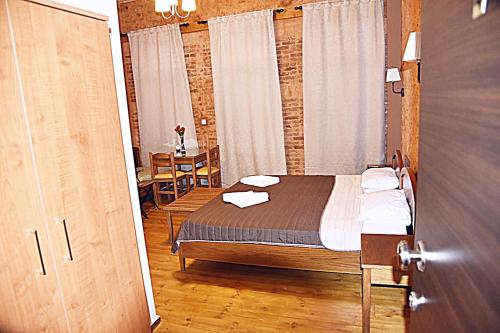 En eller flere senger på et rom på Santrivani Rooms
