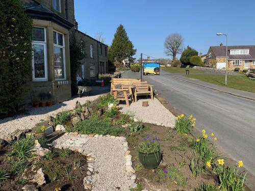 a table and benches on the side of a street at Craiglands Bed and Breakfast, Grassington in Grassington