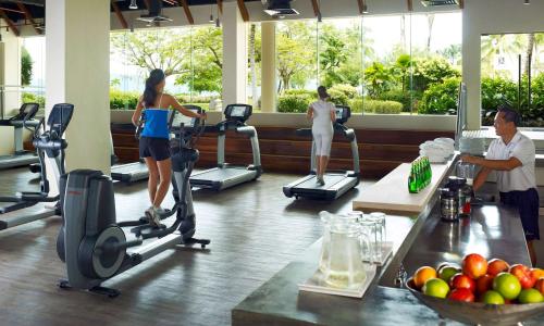 a group of people exercising on treadmills in a gym at Shangri-La Tanjung Aru, Kota Kinabalu in Kota Kinabalu