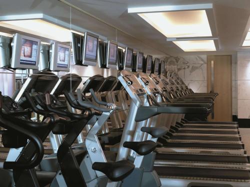 a gym with rows of treadmills and treadleys at Kowloon Shangri-La, Hong Kong in Hong Kong