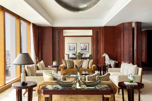 a living room with a couch and a table at Pudong Shangri-La Shanghai - With a sweeping view of the Pearl Tower and the historic Bund skyline in Shanghai