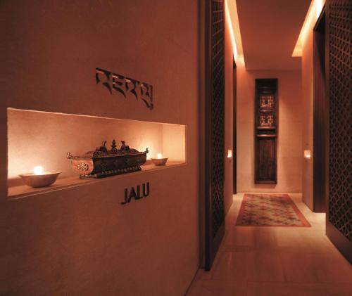 a hallway with a wall with a sign that reads jul at Pudong Shangri-La Shanghai - With a sweeping view of the Pearl Tower and the historic Bund skyline in Shanghai