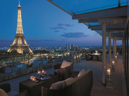 a view of the eiffel tower at night at Shangri-La Paris in Paris