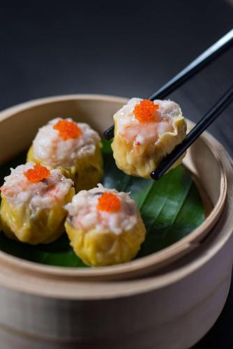 a bowl of food with chopsticks in it at Shangri-La Shenzhen - Nearby Luohu Border, Outdoor Swimming Pool in Shenzhen