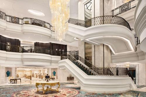 a large lobby with a staircase and a chandelier at Shangri-La Bosphorus, Istanbul in Istanbul