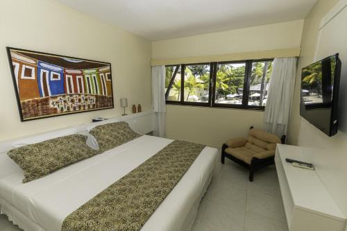 Posteľ alebo postele v izbe v ubytovaní Orange Praia Hotel