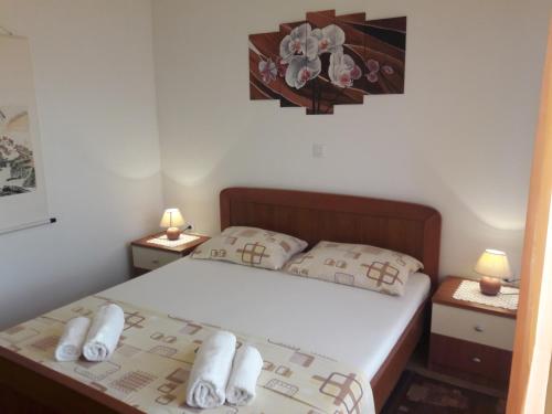 Postel nebo postele na pokoji v ubytování Apartmani Prpić