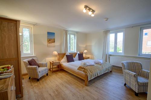 Katil atau katil-katil dalam bilik di Das Frühstückshotel Sankt Peter-Ording