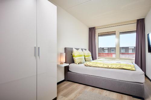 Postel nebo postele na pokoji v ubytování Appartement Amelanderoase 83 im Amelander Paradijs