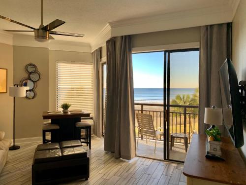 a living room with a view of the ocean at 210 Sea Gem Oceanfront Pet Friendly Oceanfront in Myrtle Beach