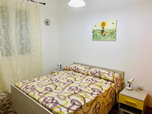 Postel nebo postele na pokoji v ubytování Appartamenti Maraneddhe