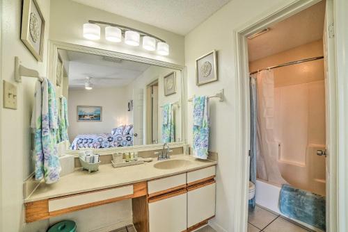 a bathroom with a sink and a mirror at Waterfront Luxury House: Dock, Fire Pit & Fishing in Corpus Christi