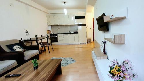 a living room with a couch and a coffee table at Tetovo Apartment Superb Location in Tetovo