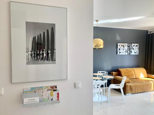 a living room with a couch and a table at Sopocka Bryza in Sopot