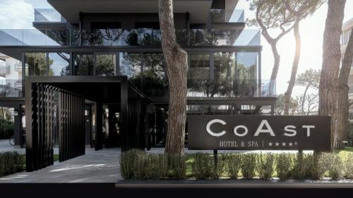 a building with a sign for a coast hotel and spa at Coast Hotel & Spa - Adults Only Aperto tutto l'anno in Milano Marittima
