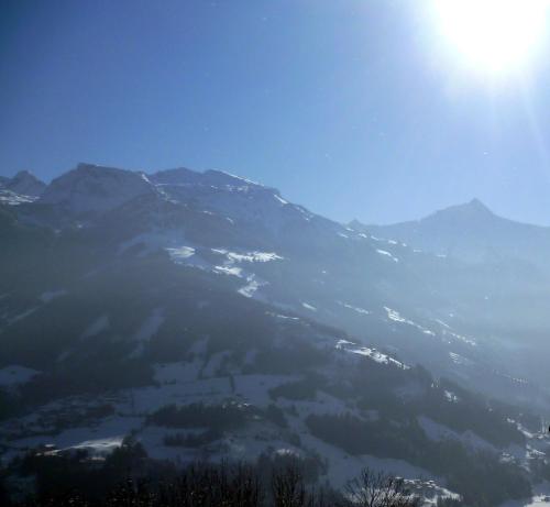 a view of a mountain with the sun in the sky at Haus Burbach in Zellberg
