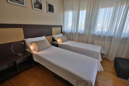 Giường trong phòng chung tại Business & Travel Apartments