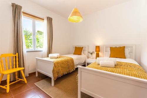 Giường trong phòng chung tại Quinta da Asneira