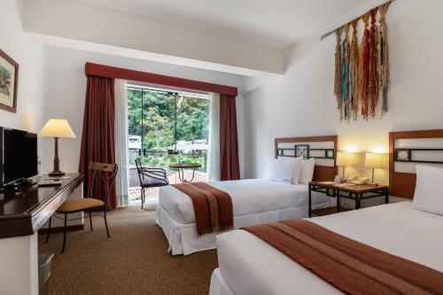 Giường trong phòng chung tại Tierra Viva Machu Picchu Hotel