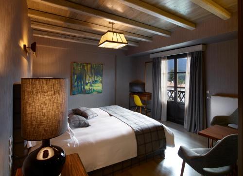 Posteľ alebo postele v izbe v ubytovaní Art Mainalon Hotel