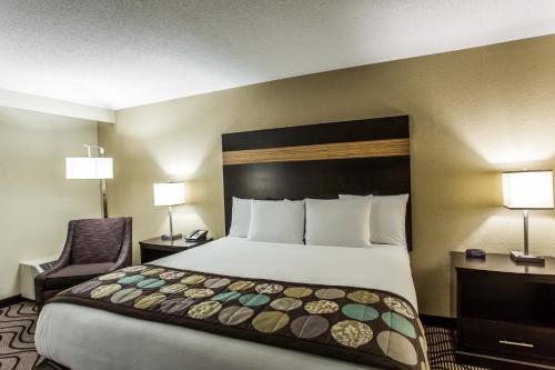 A bed or beds in a room at Clarion Hotel Airport & Conference Center