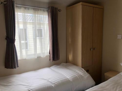 Katil atau katil-katil dalam bilik di Emmanuel Holiday Home
