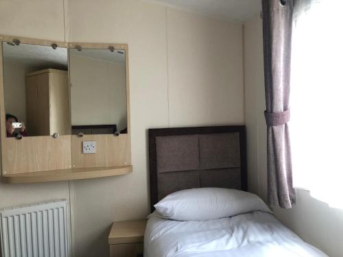 Katil atau katil-katil dalam bilik di Emmanuel Holiday Home