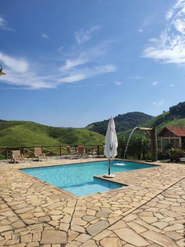 A piscina localizada em Pousada Recanto da Lunane ou nos arredores